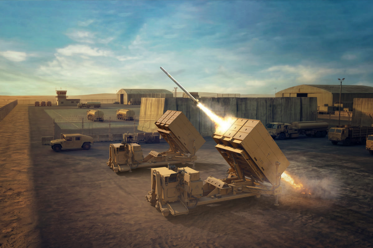 A ground-based air defense launcher firing an interceptor from a hardened desert airbase